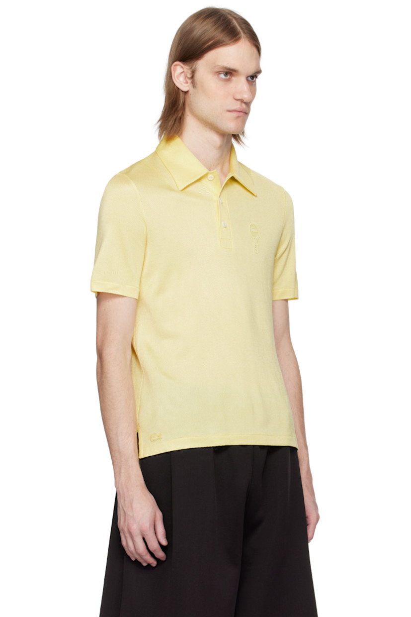 Semi-sheer stretch rayon piqué polo.

· Lightweight 
· Spread collar
· Three-button placket
· Embroidered logo patch at chest and front hem 
· Droptail hem
· Mother-of-pearl hardware

Supplier color: Pastel yellow