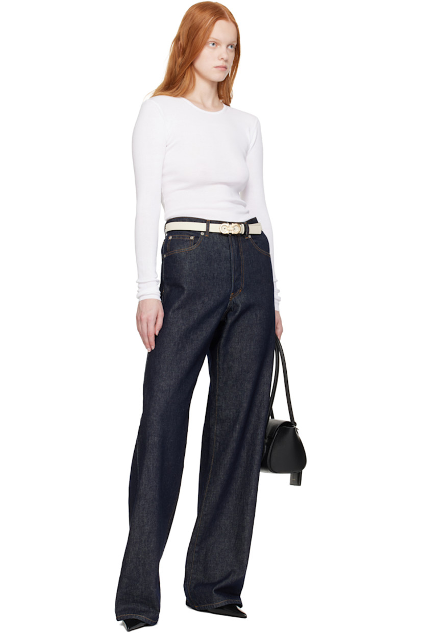 Reversible buffed calfskin belt in black. 

Reverse in beige buffed calfskin.

· Keeper loops at length
· Textured logo hardware at post-stud fastening 
· Gold-tone hardware
· W1"

Supplier color: Mascarpone/Nero