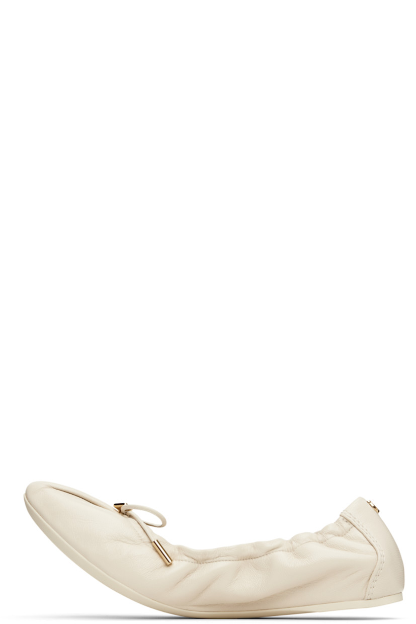 Grained nappa lambskin ballerina flats in off-white. 

· Pointed square toe 
· Logo charm and bow accent at vamp
· Elasticized collar
· Logo hardware at heel collar
· Lambskin lining
· Treaded rubber sole 
· Gold-tone hardware

Supplier color: Mascarpone
