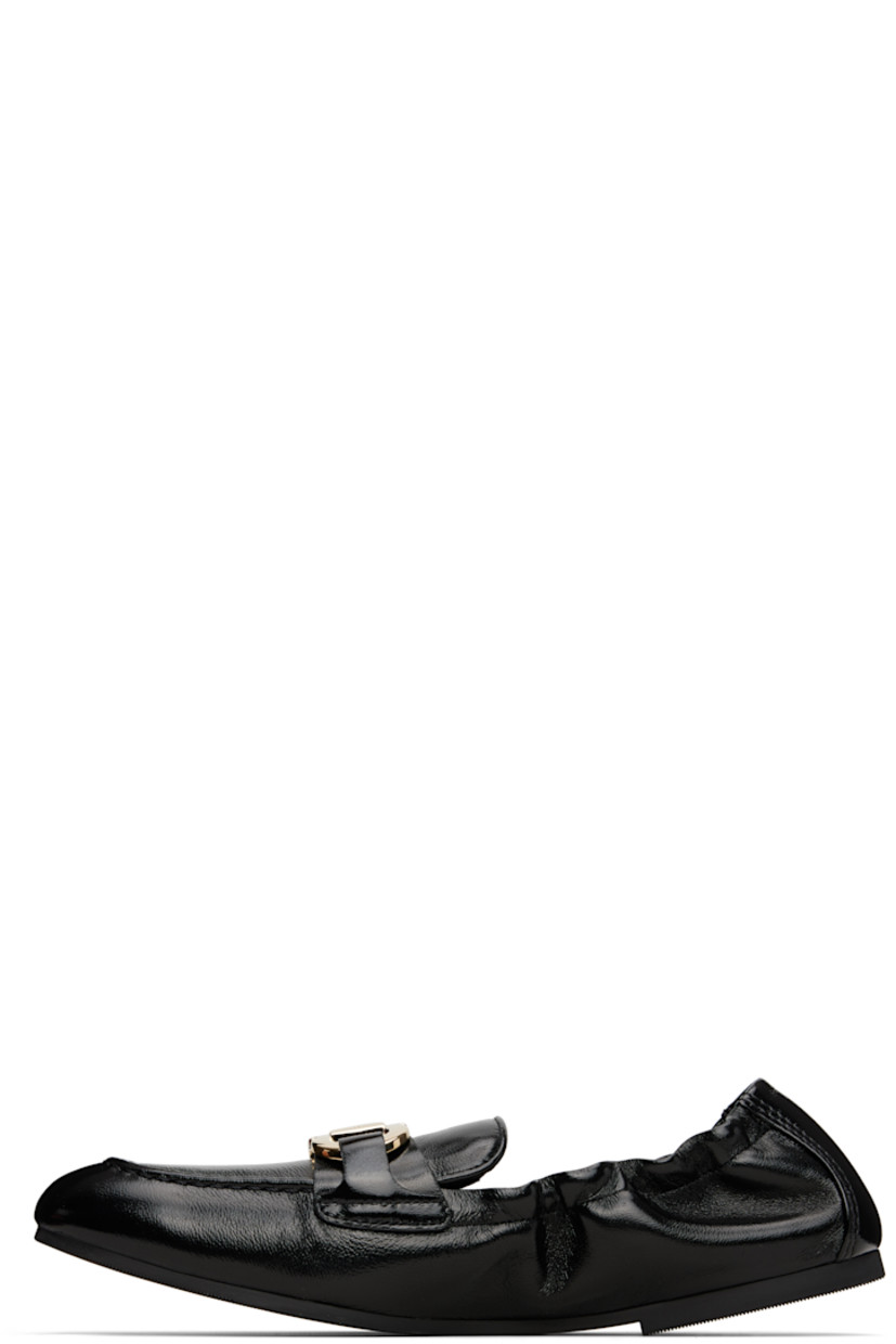 Crackled patent lambskin loafers in black. 

· Moc toe
· Logo hardware at vamp
· Elasticized collar
· Treaded rubber sole 
· Gold-tone hardware

Supplier color: Black