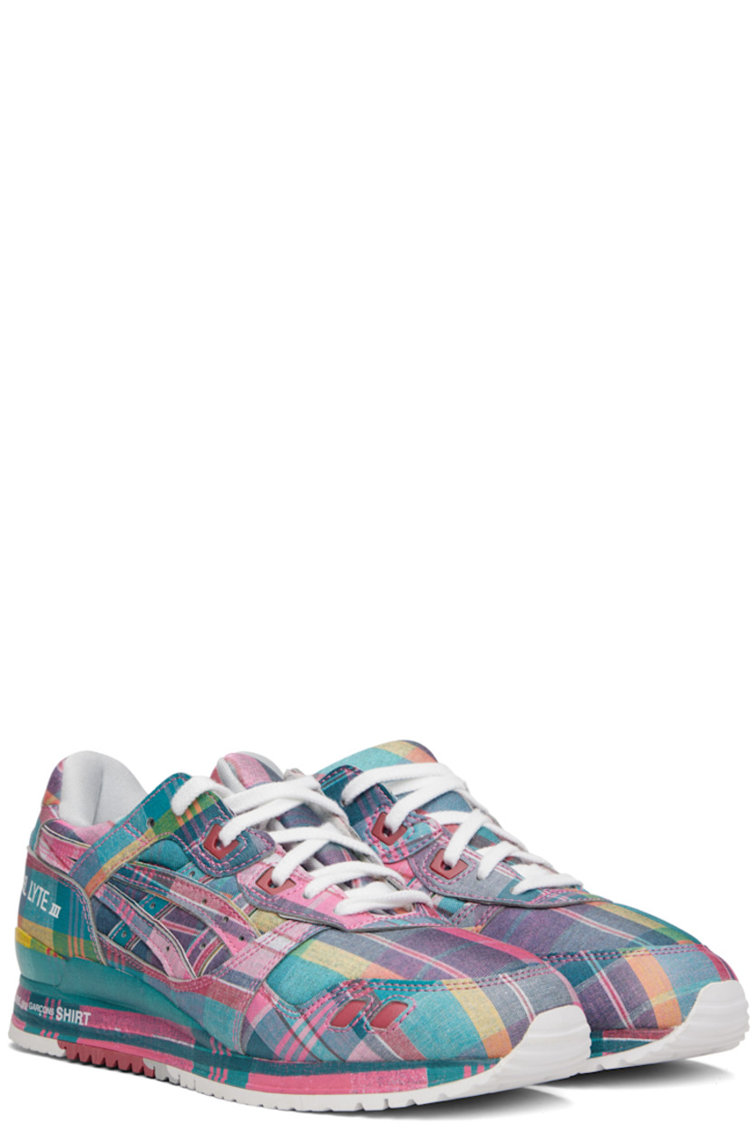 Low-top plain-woven and buffed faux-leather sneakers in pink.

· Check pattern printed throughout
· Lace-up closure
· Vent at modified padded tongue
· Padded collar
· Logo appliqués and perforations at sides
· Logos printed at outer side and heel tab
· Faille lining
· Treaded rubber sole

Part of the Comme des Garçons Shirt x ASICS collaboration.

Supplier color: Pink/Multi