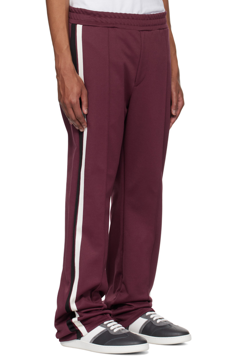 Recycled polyester- and cotton-blend jersey sweatpants.

· Concealed drawstring at elasticized waistband
· Four-pocket styling
· Zip-fly
· Pinched seams at front 
· Stripes at outseams
· Logo embroidered at back pocket

Supplier color: Oxblood/Nero