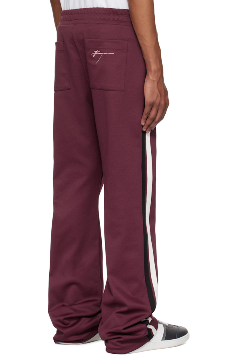 Recycled polyester- and cotton-blend jersey sweatpants.

· Concealed drawstring at elasticized waistband
· Four-pocket styling
· Zip-fly
· Pinched seams at front 
· Stripes at outseams
· Logo embroidered at back pocket

Supplier color: Oxblood/Nero