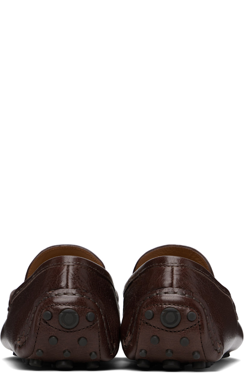 Lightweight grained buffalo leather loafers in brown. 

· Hand-stitched detailing throughout
· Moc toe
· Strap with logo hardware at vamp
· Buffed leather lining
· Pebbled rubber sole

Supplier color: Tamarind