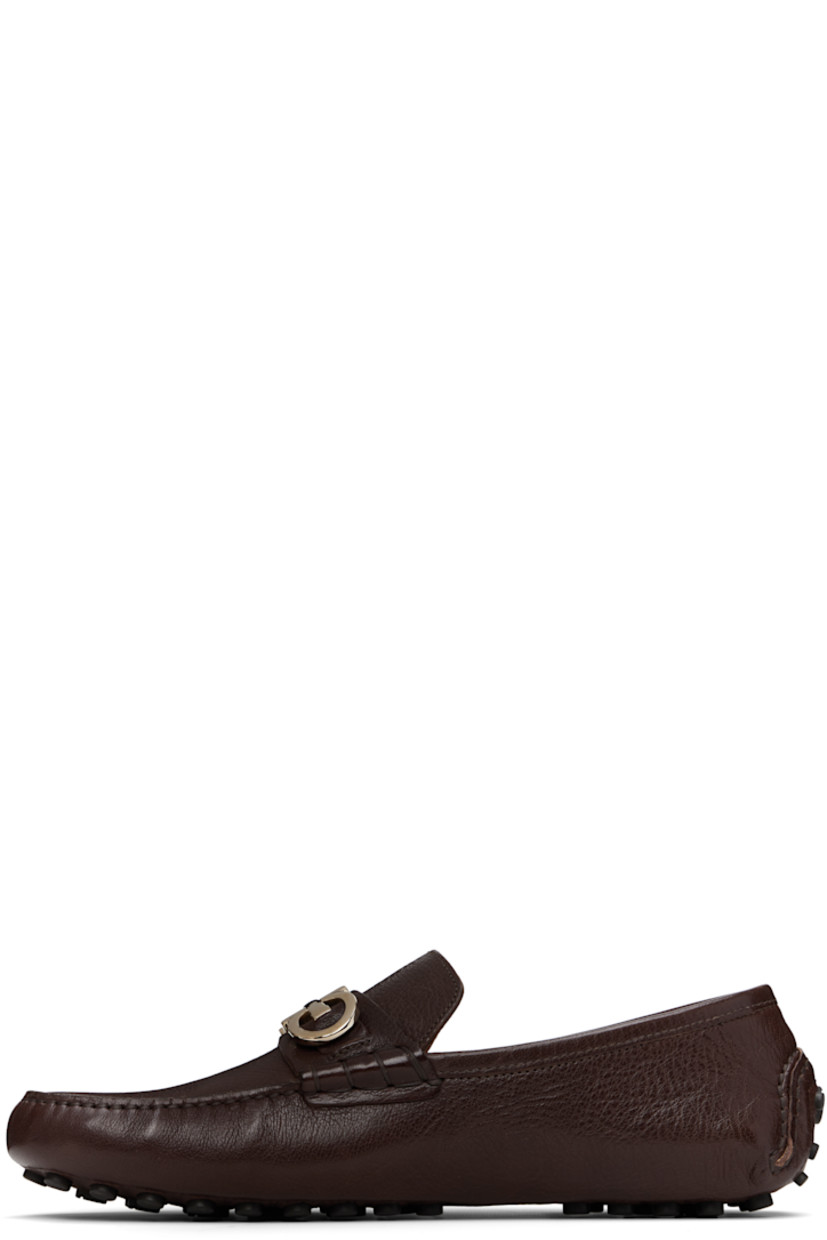 Lightweight grained buffalo leather loafers in brown. 

· Hand-stitched detailing throughout
· Moc toe
· Strap with logo hardware at vamp
· Buffed leather lining
· Pebbled rubber sole

Supplier color: Tamarind