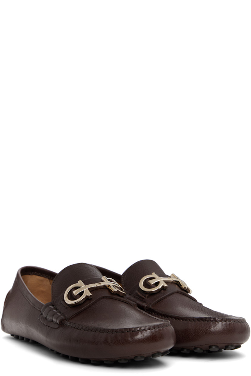 Lightweight grained buffalo leather loafers in brown. 

· Hand-stitched detailing throughout
· Moc toe
· Strap with logo hardware at vamp
· Buffed leather lining
· Pebbled rubber sole

Supplier color: Tamarind