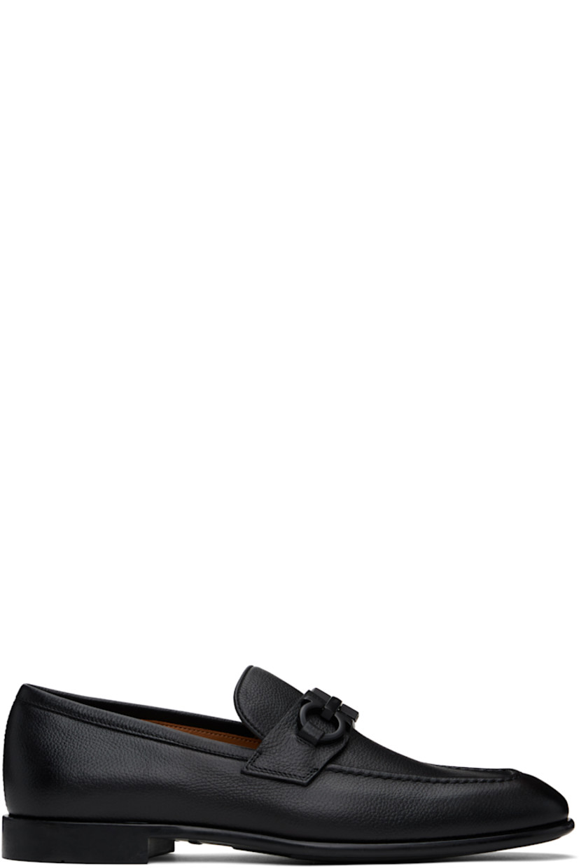 Grained calfskin loafers in black.

· Moc toe
· Strap and logo hardware at vamp
· Logo stamp at padded footbed
· Buffed calfskin lining
· Treaded rubber sole

Supplier color: Black/Cookie
