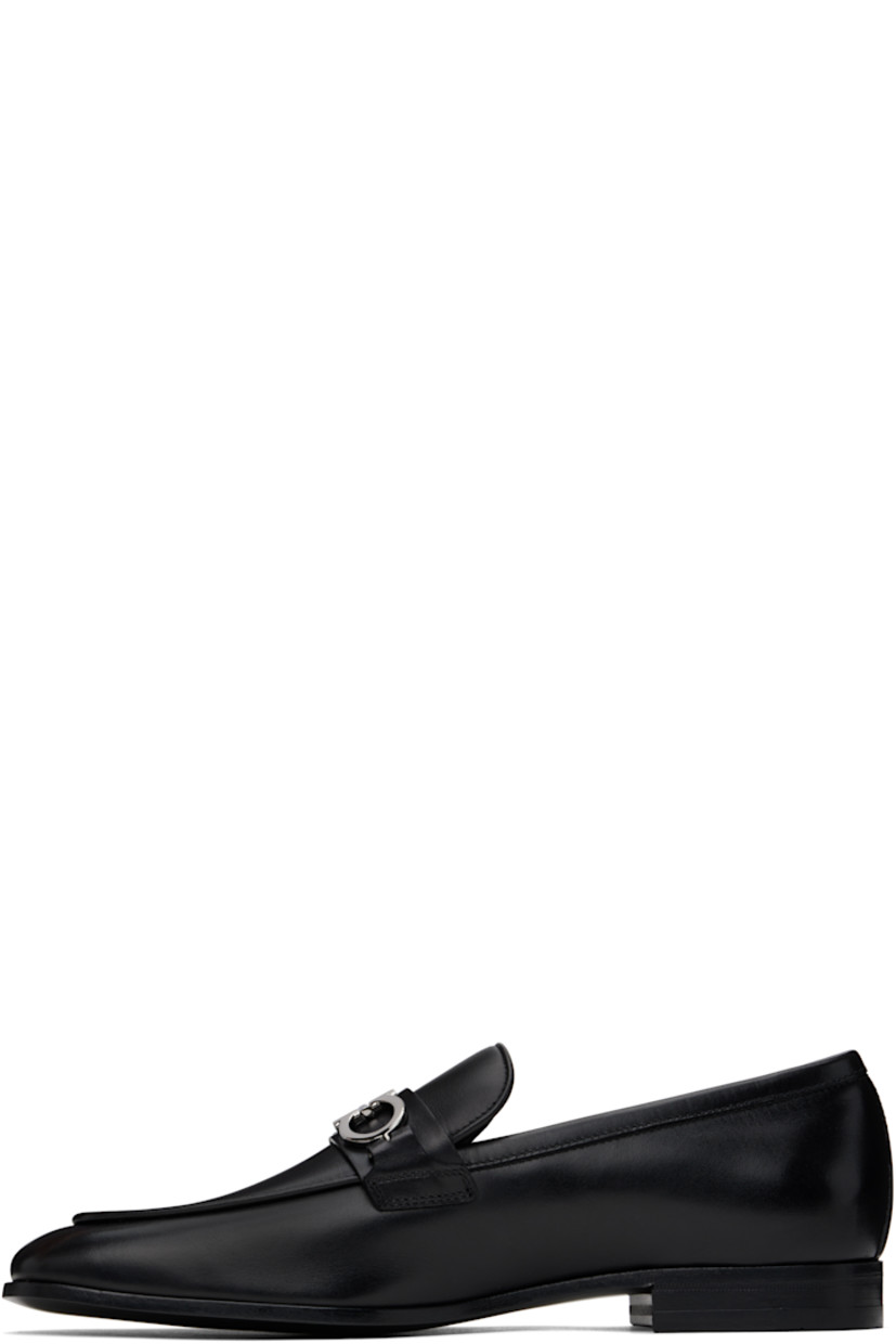 Buffed calfskin loafers in black.

· Moc toe
· Strap and logo hardware at vamp
· Logo stamp at padded footbed
· Buffed calfskin lining
· Stacked leather heel with rubber injection
· Leather sole

Supplier color: Black