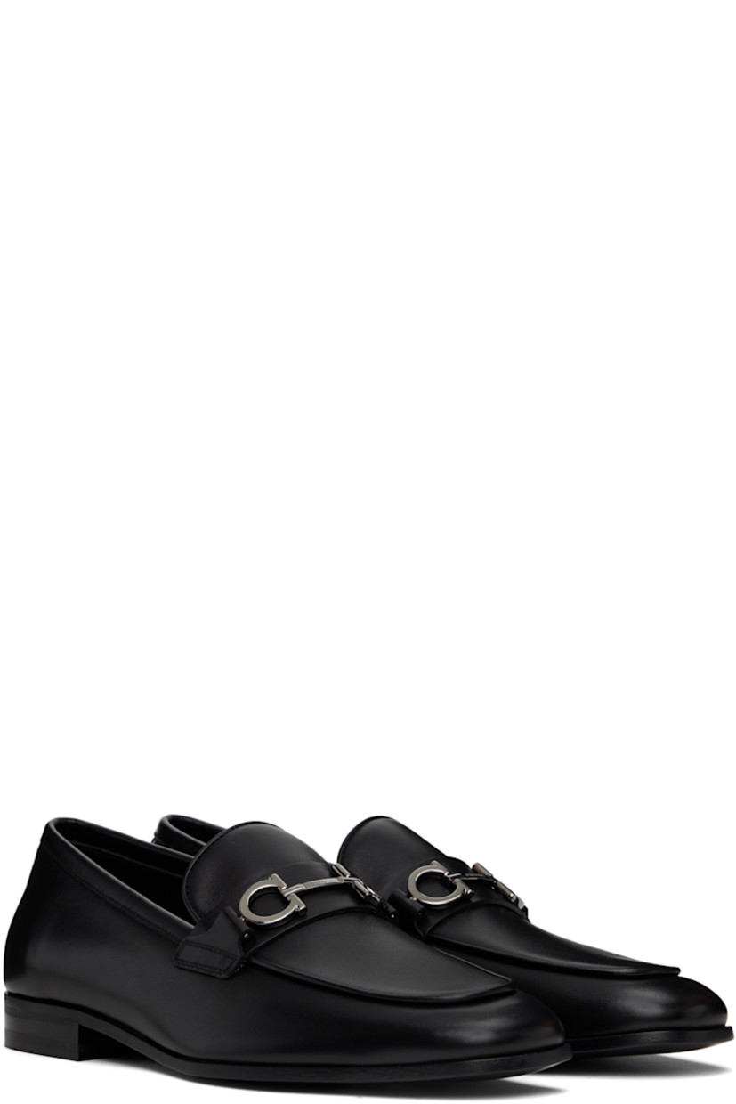 Buffed calfskin loafers in black.

· Moc toe
· Strap and logo hardware at vamp
· Logo stamp at padded footbed
· Buffed calfskin lining
· Stacked leather heel with rubber injection
· Leather sole

Supplier color: Black