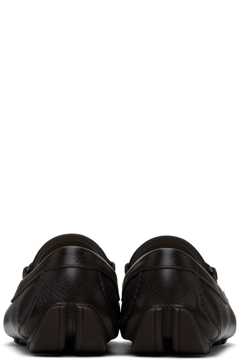 Handcrafted lightweight hammered calfskin loafers in brown.

· Moc toe
· Strap and logo hardware at vamp
· Buffed calfskin lining
· Treaded rubber sole

Supplier color: Brown