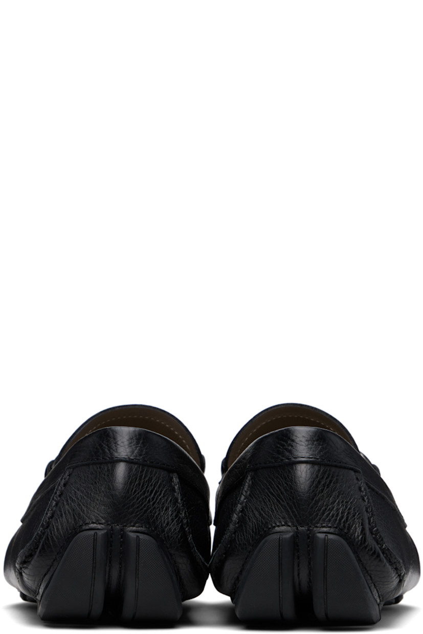 Handcrafted lightweight hammered calfskin loafers in black. 

· Moc toe
· Strap with logo hardware at vamp
· Grained calfskin lining
· Treaded rubber sole

Supplier color: Black