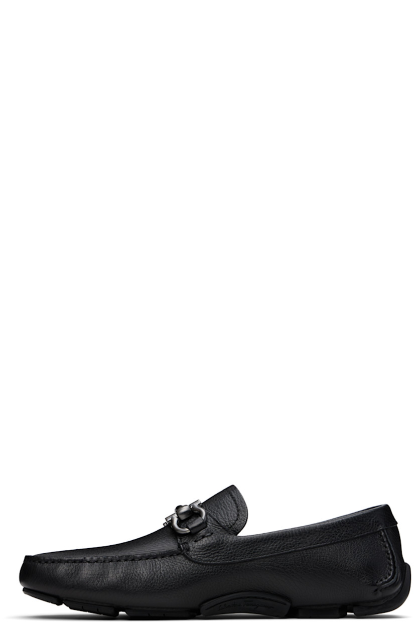 Handcrafted lightweight hammered calfskin loafers in black. 

· Moc toe
· Strap with logo hardware at vamp
· Grained calfskin lining
· Treaded rubber sole

Supplier color: Black