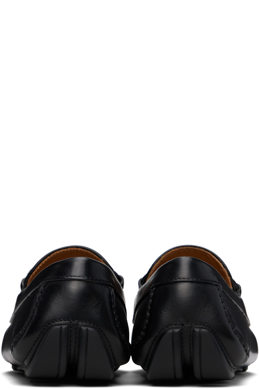 Lightweight buffed calfskin and twill loafers in black. 

· Hand-stitched detailing throughout
· Moc toe
· Jacquard logo pattern at vamp
· Strap with logo hardware
· Buffed calfskin lining
· Treaded rubber sole

Supplier color: Black