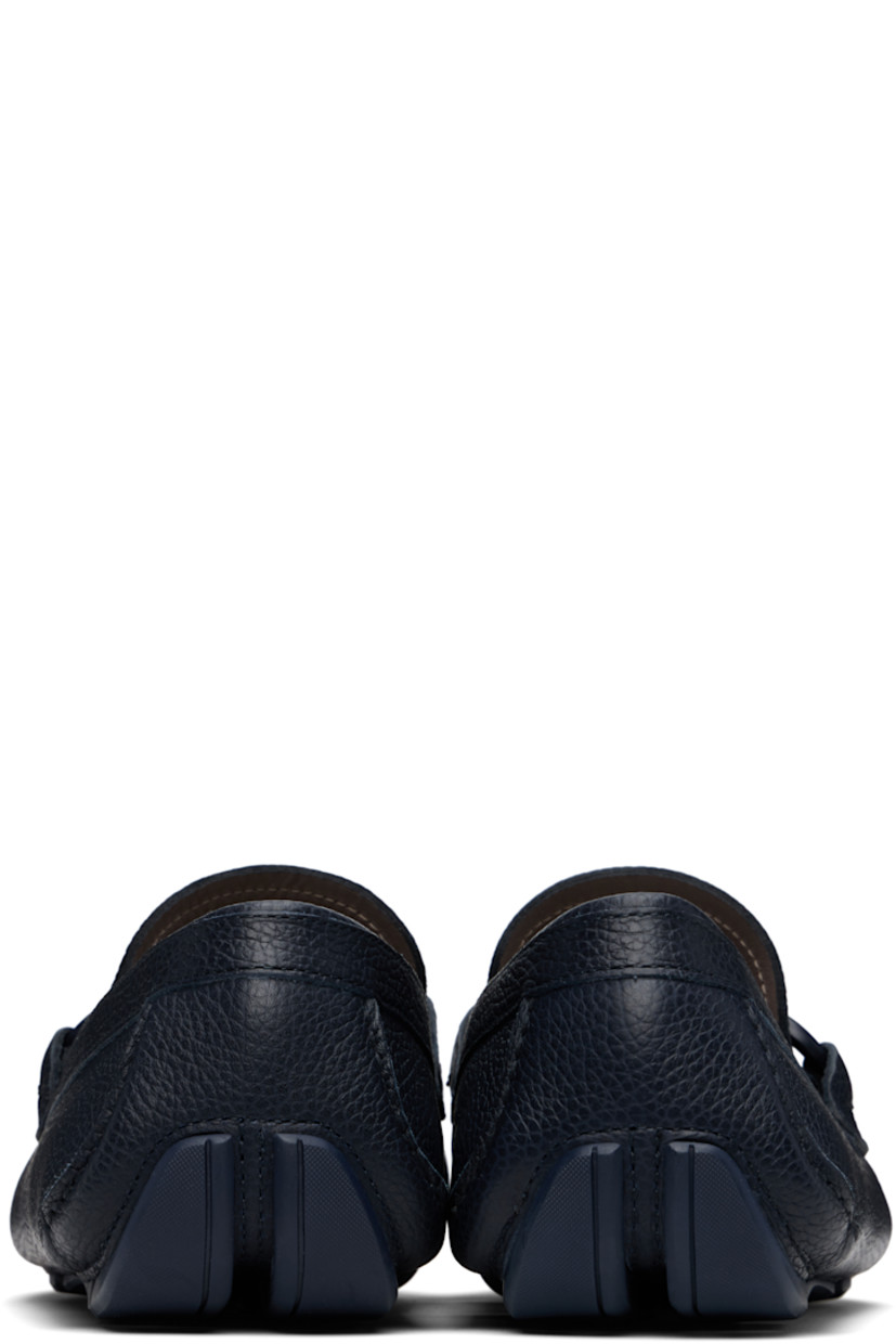 Handcrafted lightweight grained calfskin loafers in navy. 

· Moc toe
· Braided strap and logo hardware at vamp
· Buffed calfskin lining
· Treaded rubber sole

Supplier color: Marine blue