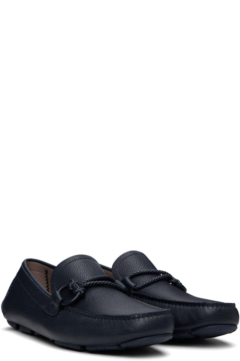 Handcrafted lightweight grained calfskin loafers in navy. 

· Moc toe
· Braided strap and logo hardware at vamp
· Buffed calfskin lining
· Treaded rubber sole

Supplier color: Marine blue