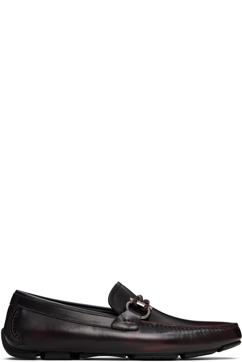 Buffed calfskin loafers in burgundy. 

· Smudging throughout
· Moc toe
· Braided strap and logo hardware at vamp
· Buffed calfskin lining
· Hand-sewn treaded rubber sole

Supplier color: Cordovan