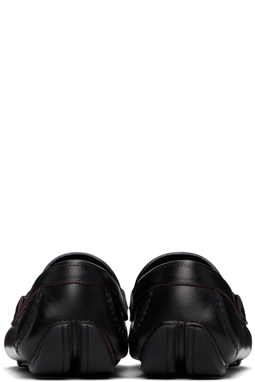 Buffed calfskin loafers in burgundy. 

· Smudging throughout
· Moc toe
· Braided strap and logo hardware at vamp
· Buffed calfskin lining
· Hand-sewn treaded rubber sole

Supplier color: Cordovan