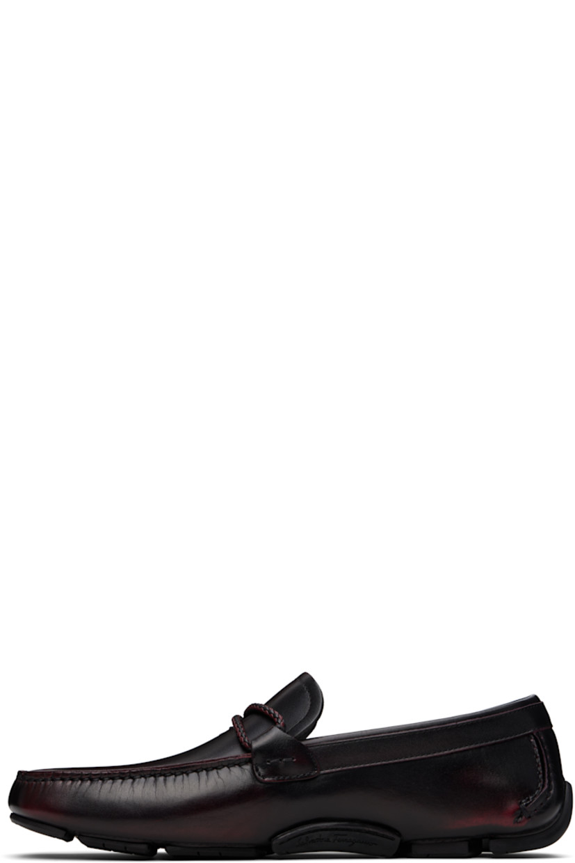 Buffed calfskin loafers in burgundy. 

· Smudging throughout
· Moc toe
· Braided strap and logo hardware at vamp
· Buffed calfskin lining
· Hand-sewn treaded rubber sole

Supplier color: Cordovan