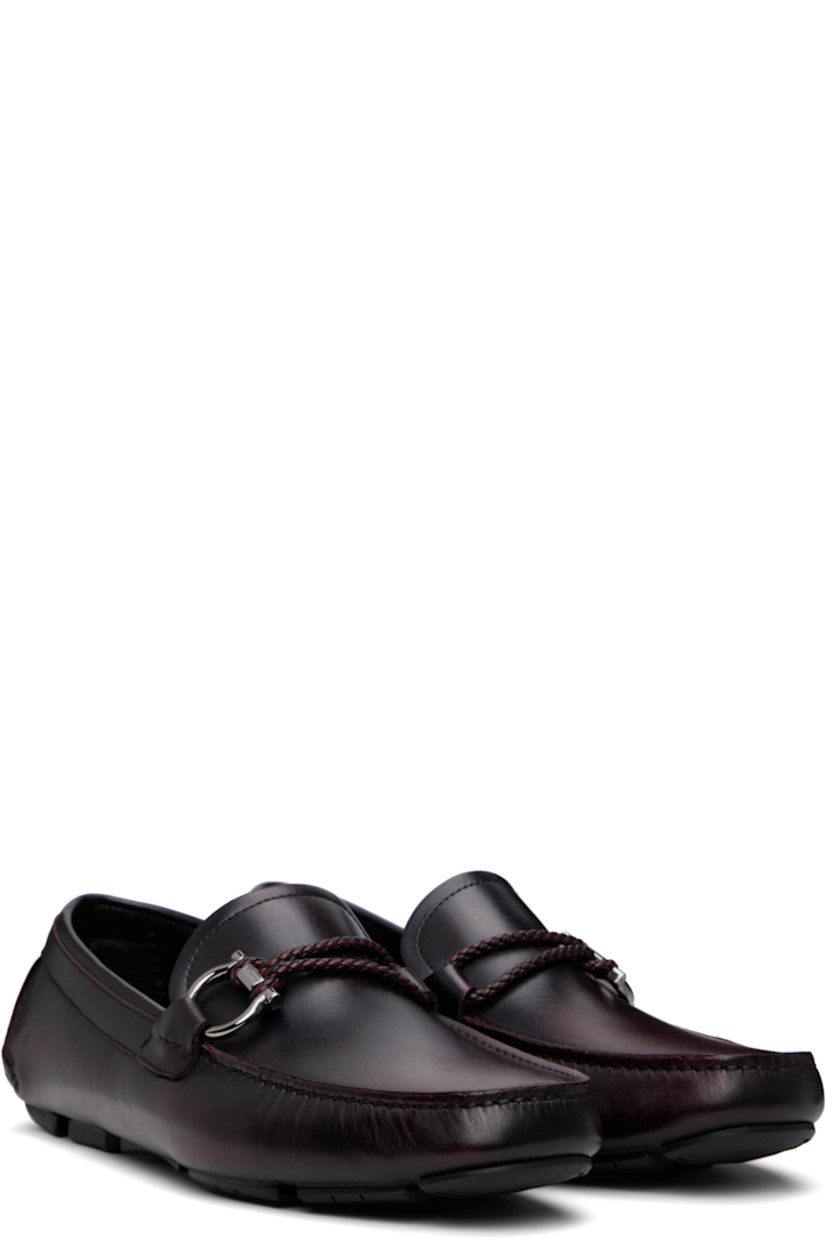 Buffed calfskin loafers in burgundy. 

· Smudging throughout
· Moc toe
· Braided strap and logo hardware at vamp
· Buffed calfskin lining
· Hand-sewn treaded rubber sole

Supplier color: Cordovan