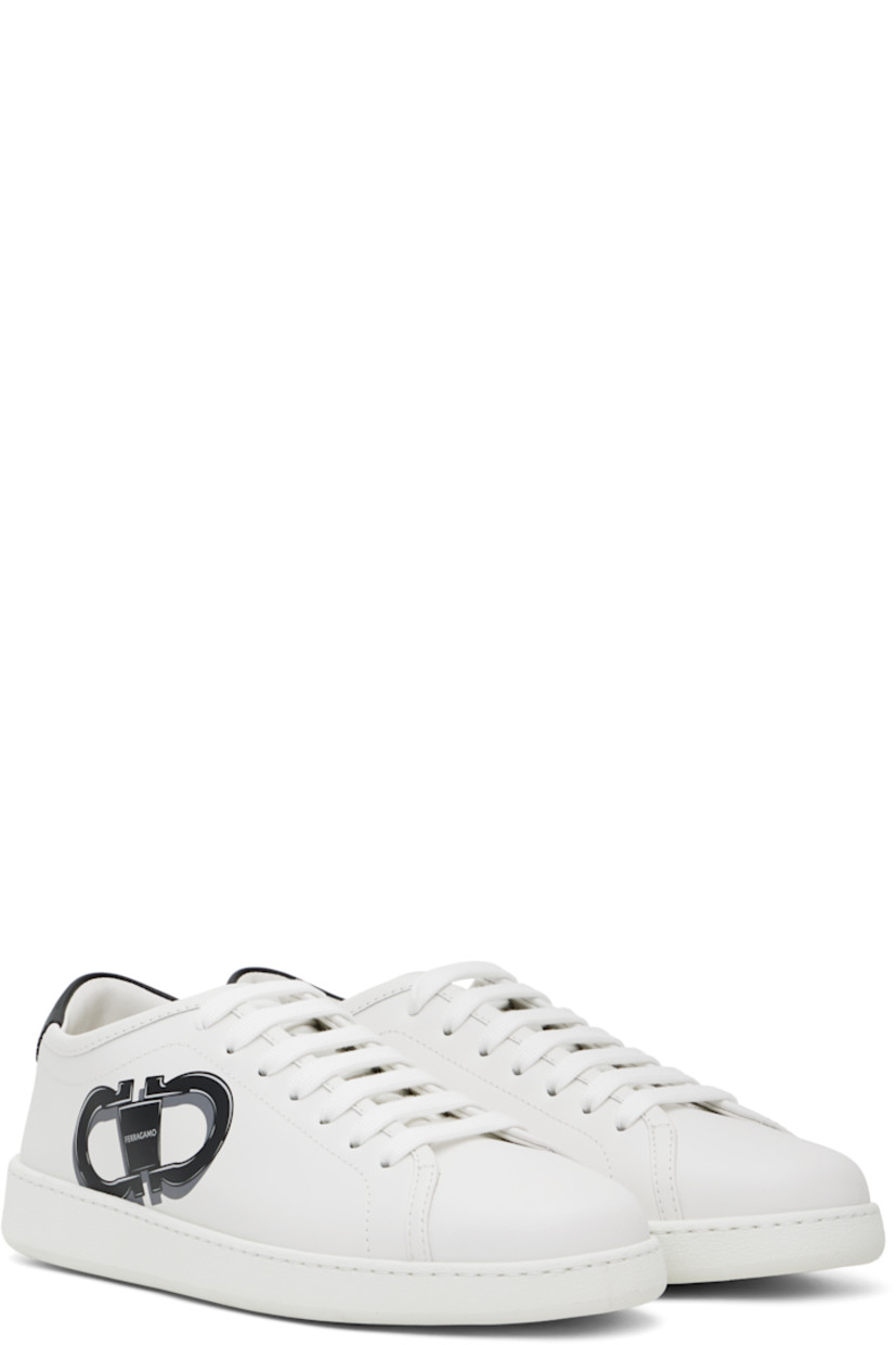 Low-top buffed calfskin sneakers in white.

· Lace-up closure
· Logo embossed at padded tongue
· Padded collar
· Logo graphic printed at outer side
· Logo embossed at heel
· Treaded rubber sole

Supplier color: Bianco ottico/Nero