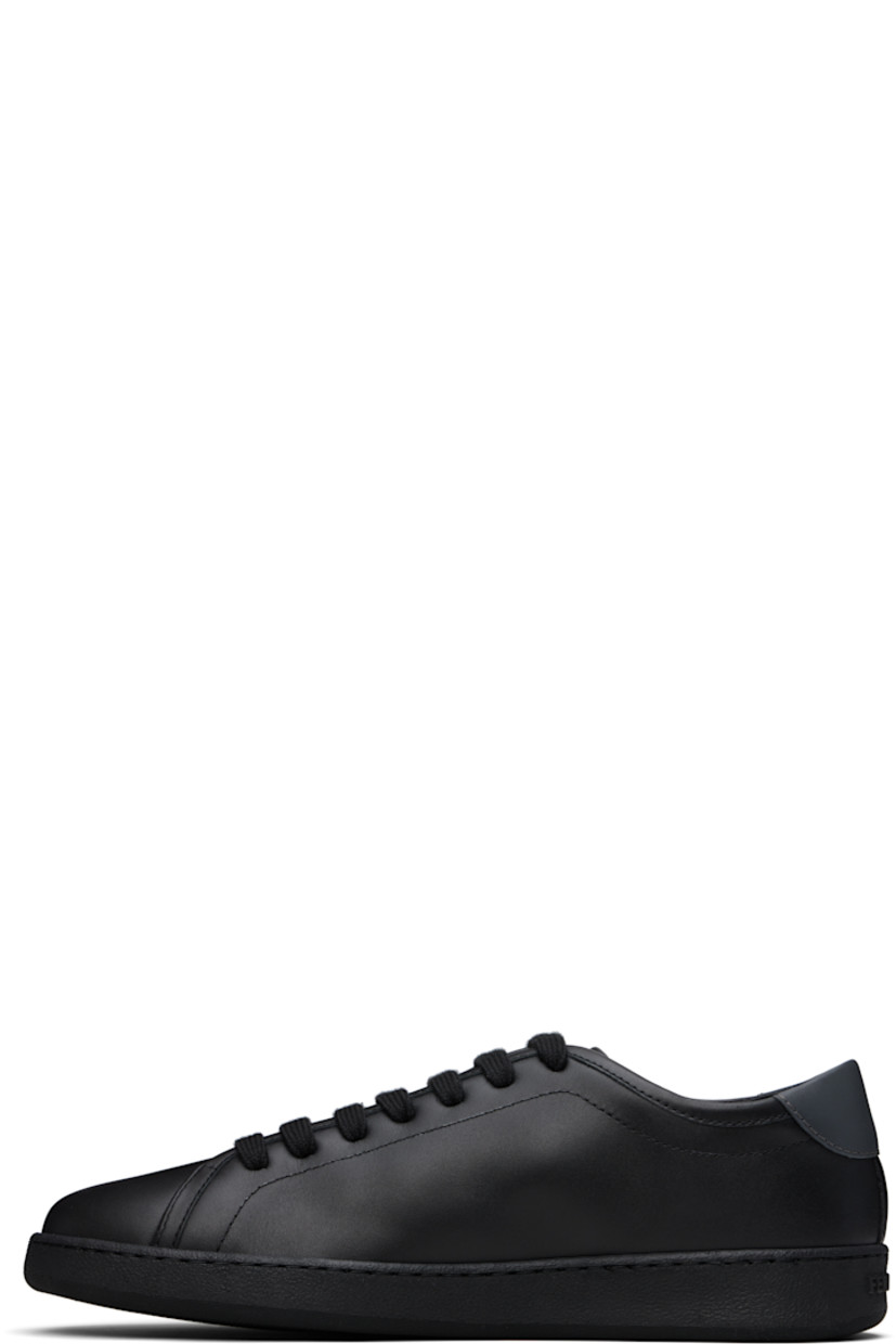 Low-top buffed calfskin sneakers in black. 

· Lace-up closure
· Logo embossed at padded tongue
· Padded collar
· Logo graphic printed at outer side 
· Buffed calfskin lining
· Logo embossed at rubber midsole
· Treaded rubber sole

Supplier color: Black/Stromboli sand