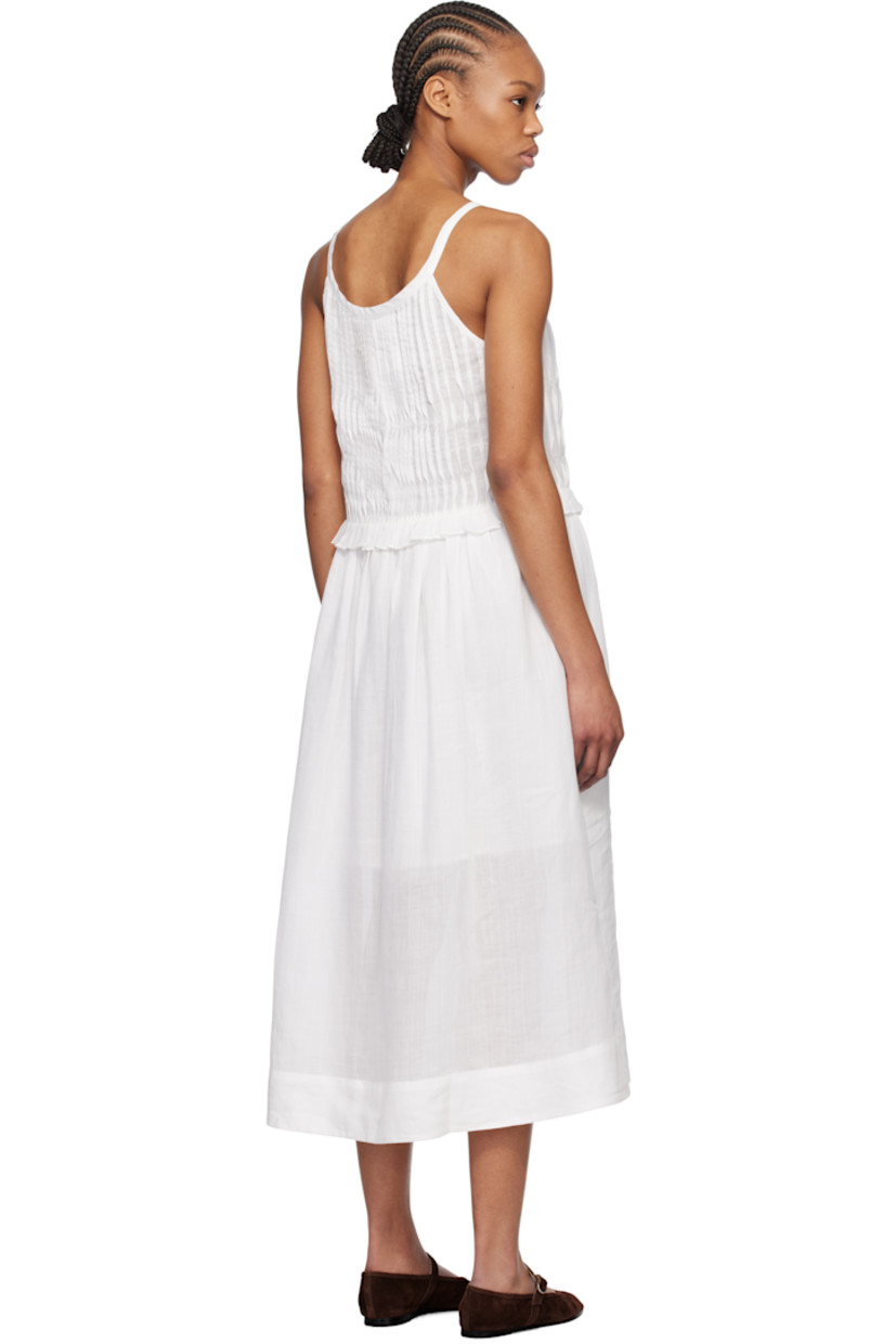 Semi-sheer ramie gauze midi dress.

· Scoop neck
· Button closure at front
· Pintucks at bust
· Ruffled edge and gathering at waist
· Fixed shoulder straps
· Partial plain-woven cotton lining
· Logo-engraved mother-of-pearl hardware

Supplier color: Pearl