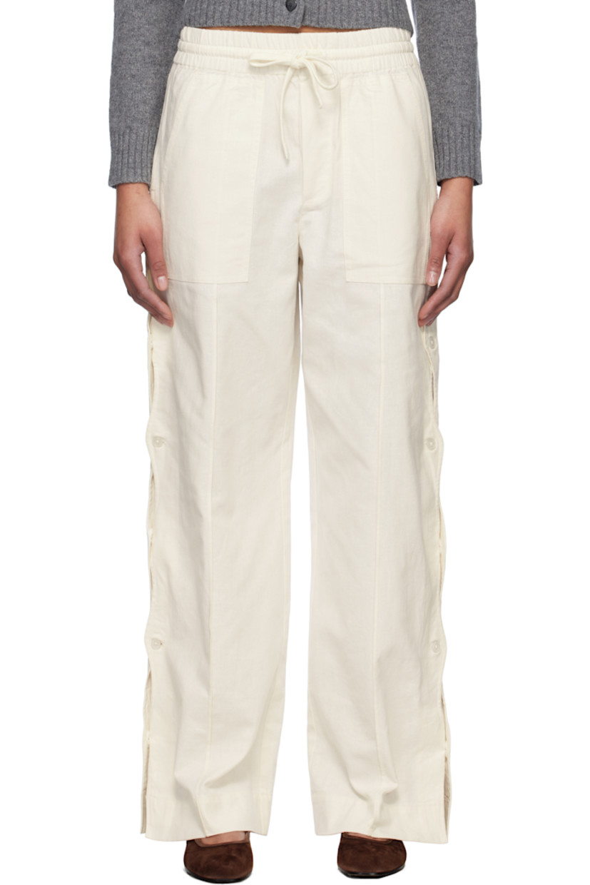 Relaxed-fit plain-woven cotton- and linen-blend trousers.

· Drawstring at elasticized waistband
· Four-pocket styling
· Mock fly
· Button vent and scalloped edge at outseams

Supplier color: Cream
