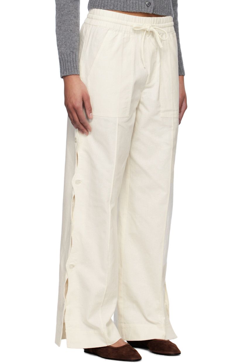 Relaxed-fit plain-woven cotton- and linen-blend trousers.

· Drawstring at elasticized waistband
· Four-pocket styling
· Mock fly
· Button vent and scalloped edge at outseams

Supplier color: Cream