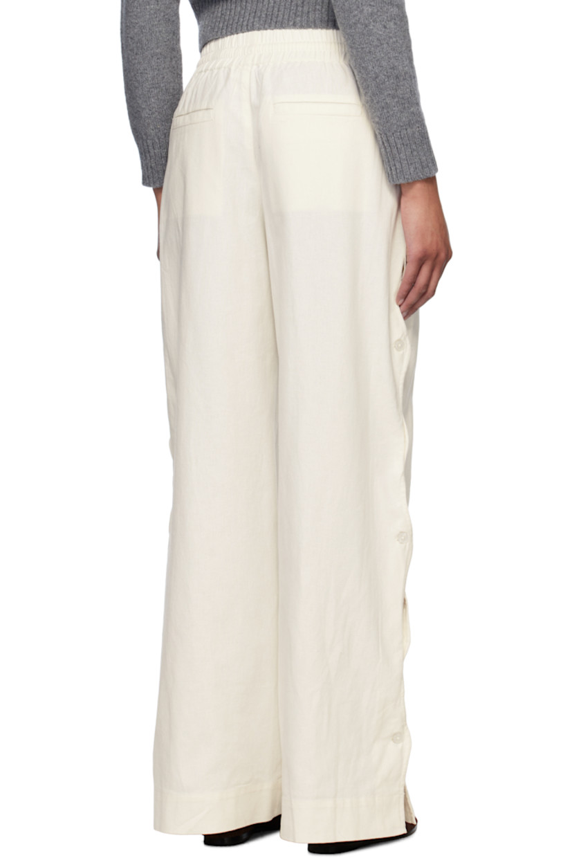 Relaxed-fit plain-woven cotton- and linen-blend trousers.

· Drawstring at elasticized waistband
· Four-pocket styling
· Mock fly
· Button vent and scalloped edge at outseams

Supplier color: Cream