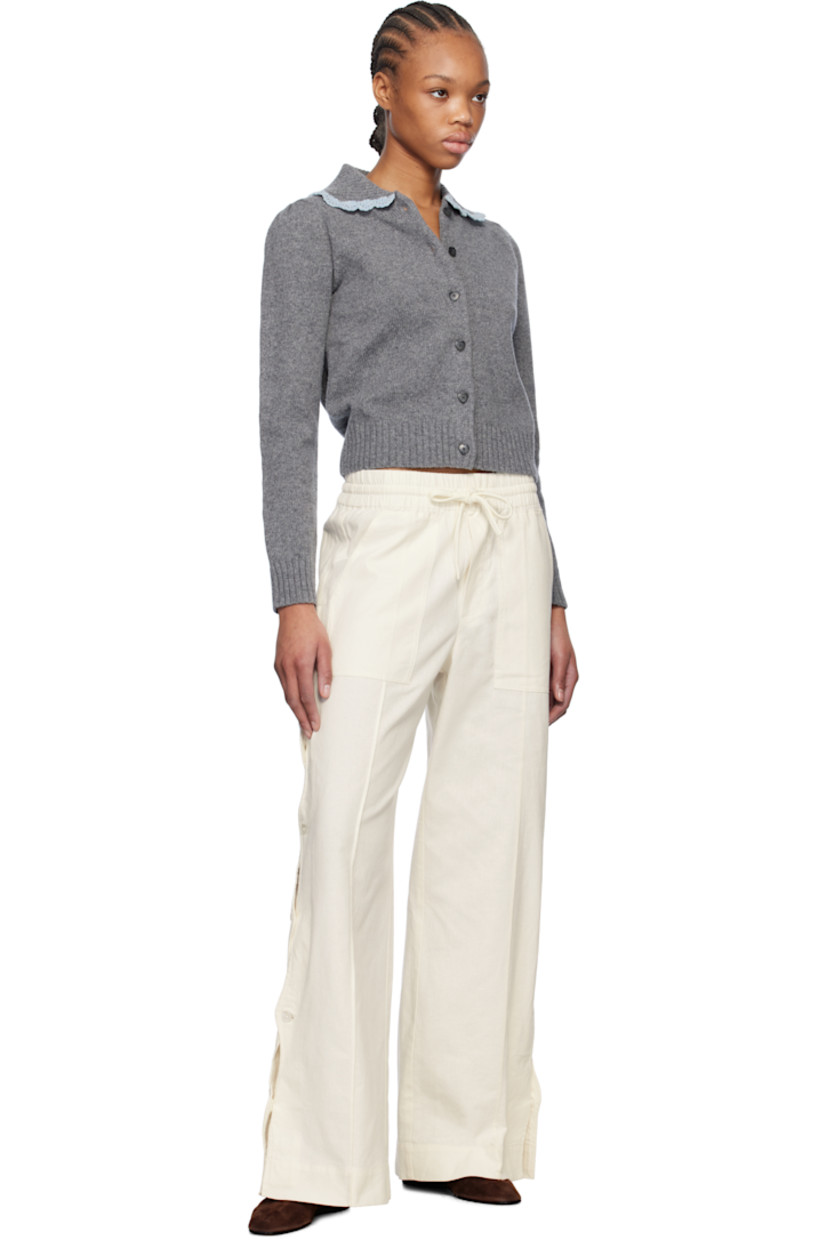 Relaxed-fit plain-woven cotton- and linen-blend trousers.

· Drawstring at elasticized waistband
· Four-pocket styling
· Mock fly
· Button vent and scalloped edge at outseams

Supplier color: Cream