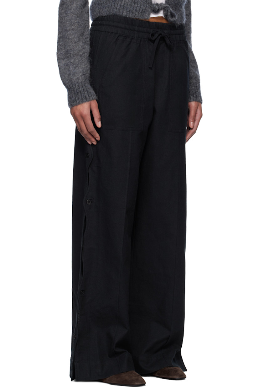 Relaxed-fit plain-woven cotton- and linen-blend trousers.

· Drawstring at elasticized waistband
· Four-pocket styling
· Mock fly
· Button vent and scalloped edge at outseams

Supplier color: Black