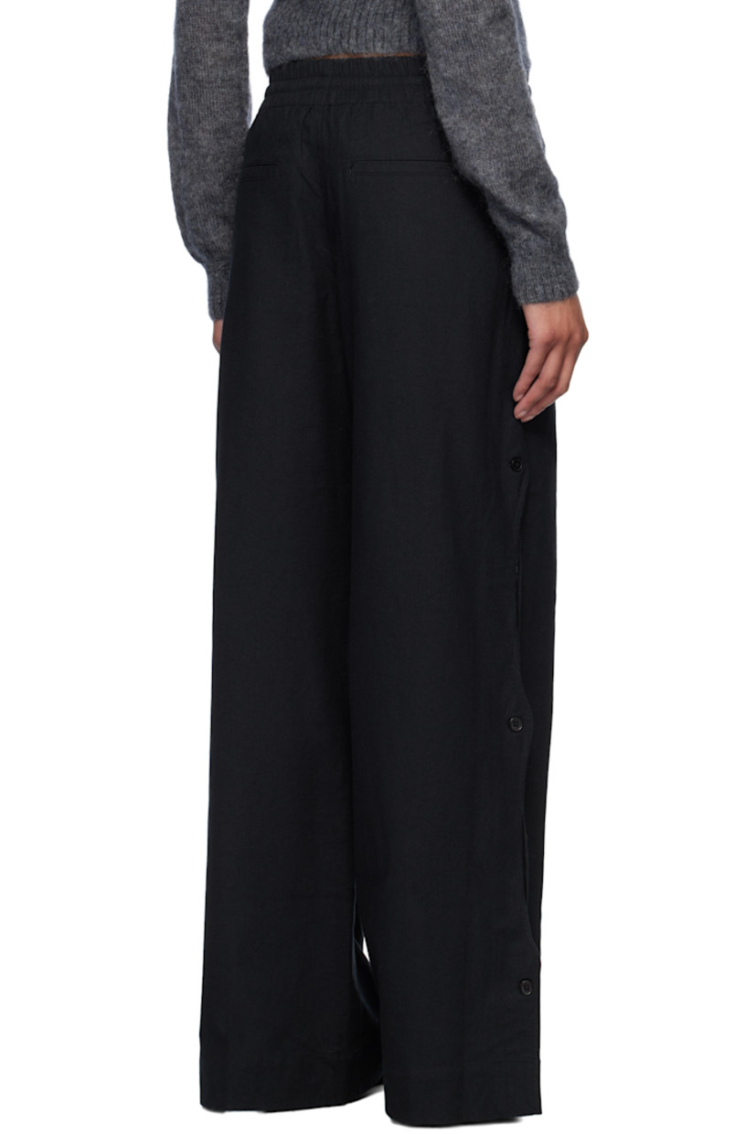 Relaxed-fit plain-woven cotton- and linen-blend trousers.

· Drawstring at elasticized waistband
· Four-pocket styling
· Mock fly
· Button vent and scalloped edge at outseams

Supplier color: Black