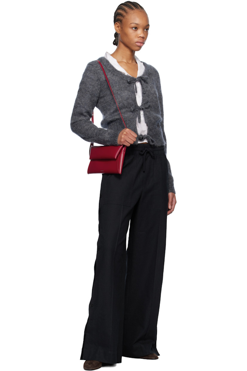 Relaxed-fit plain-woven cotton- and linen-blend trousers.

· Drawstring at elasticized waistband
· Four-pocket styling
· Mock fly
· Button vent and scalloped edge at outseams

Supplier color: Black