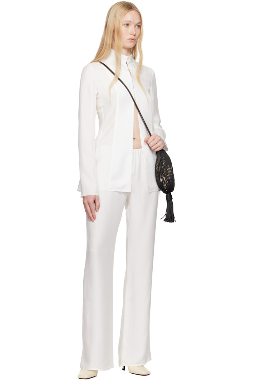 Silk twill trousers. Elasticized waistband.

Supplier color: Natural white