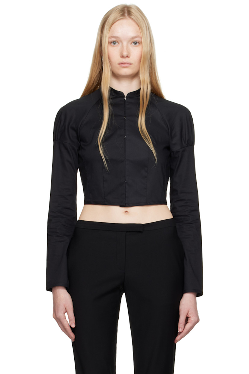 Cotton poplin shirt.

· Band collar
· Hook-eye closure
· Raglan sleeves
· Gathering at shoulders
· Press-stud fastening at cuffs
· Inverted box pleat at back

Supplier color: Black
