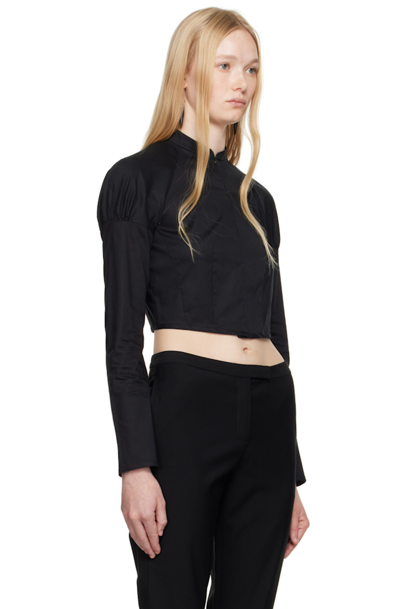 Cotton poplin shirt.

· Band collar
· Hook-eye closure
· Raglan sleeves
· Gathering at shoulders
· Press-stud fastening at cuffs
· Inverted box pleat at back

Supplier color: Black