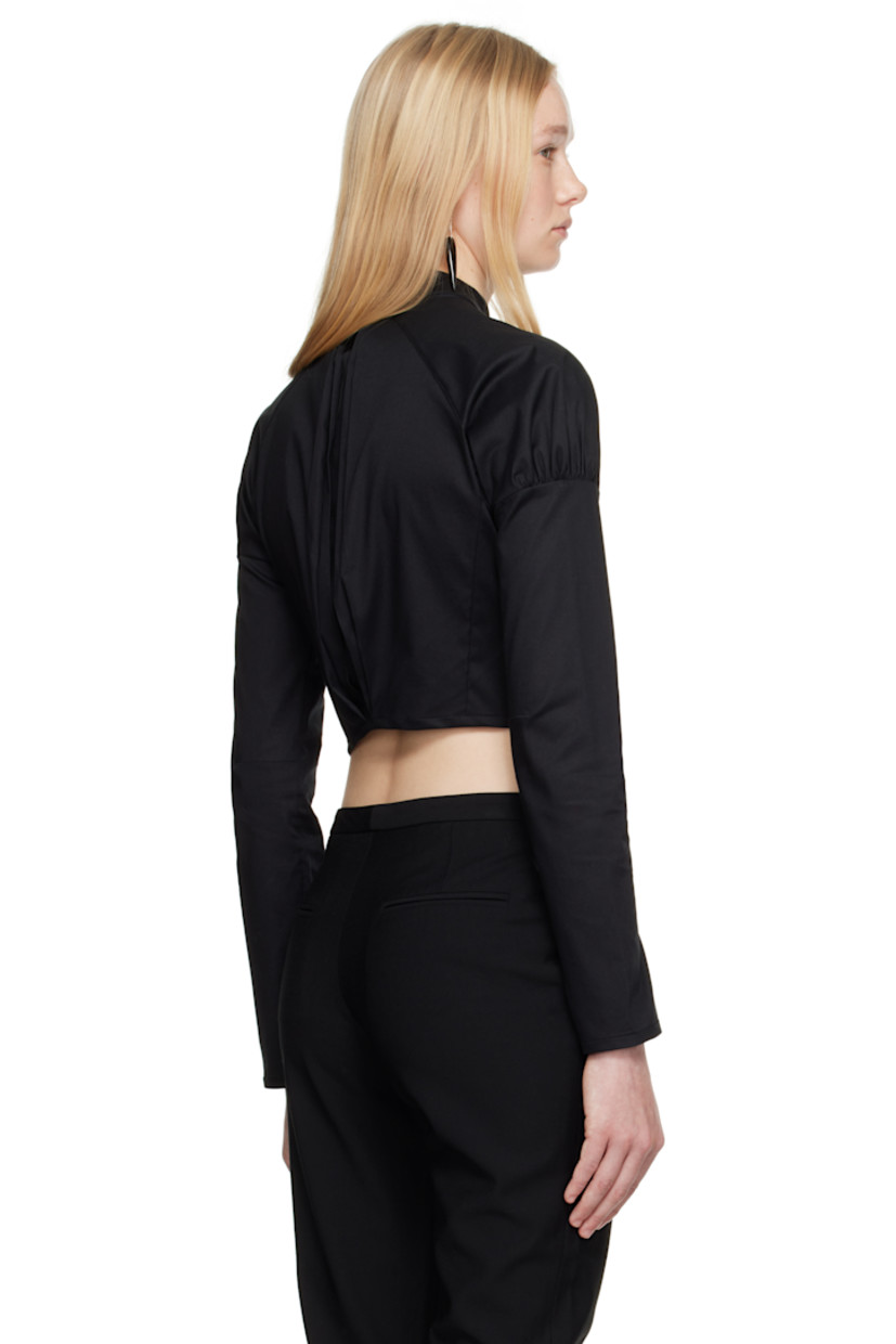Cotton poplin shirt.

· Band collar
· Hook-eye closure
· Raglan sleeves
· Gathering at shoulders
· Press-stud fastening at cuffs
· Inverted box pleat at back

Supplier color: Black