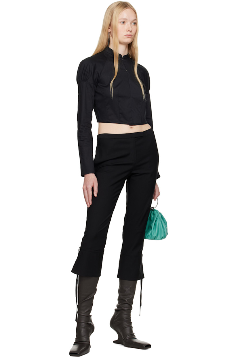 Cotton poplin shirt.

· Band collar
· Hook-eye closure
· Raglan sleeves
· Gathering at shoulders
· Press-stud fastening at cuffs
· Inverted box pleat at back

Supplier color: Black