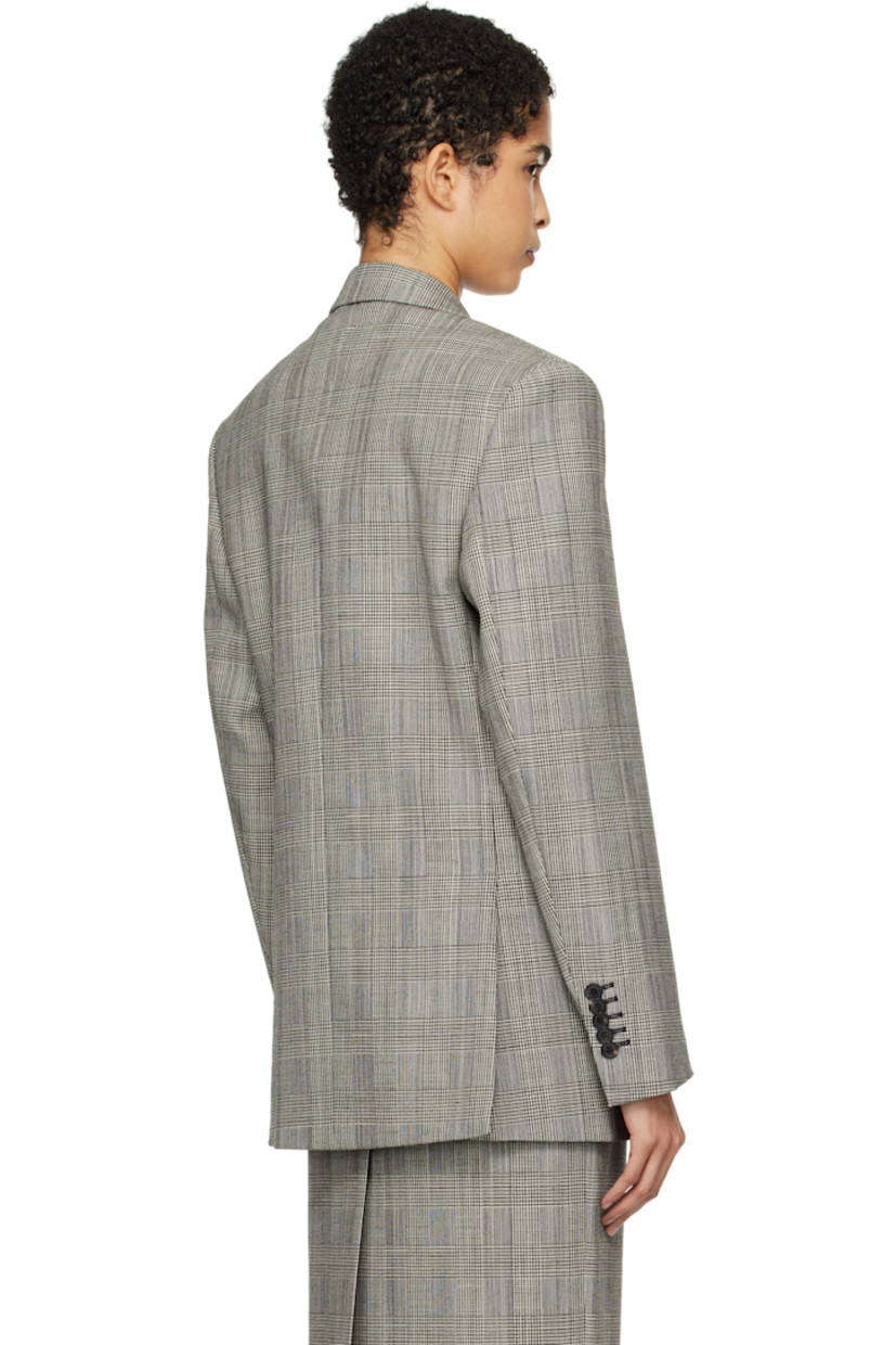 Plain-woven wool blazer. Prince of Wales pattern throughout. 

· Peaked lapel
· Double-breasted button closure
· Welt pocket and flap pockets
· Padded shoulders 
· Five-button surgeon's cuffs
· Twin vents at back hem
· Welt pocket at interior
· Full viscose twill lining

Supplier color: Prince of Wales