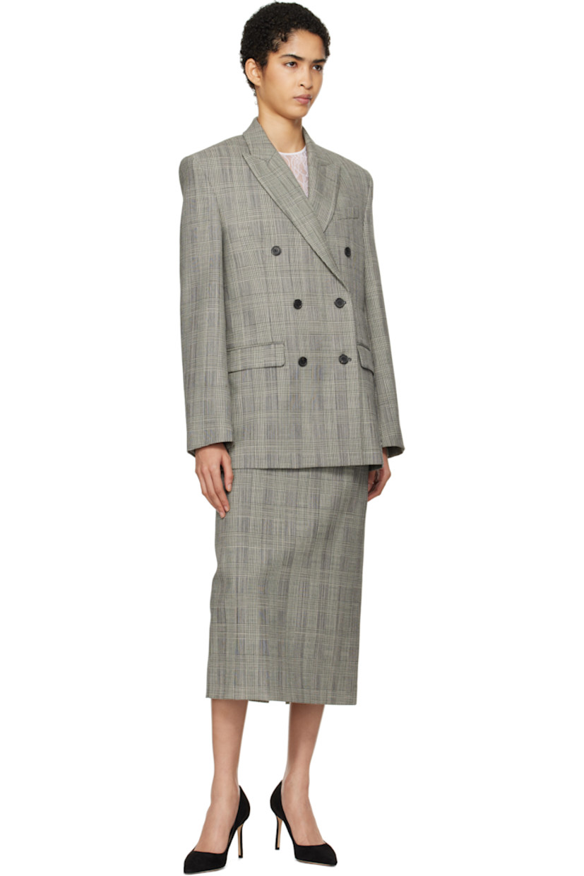 Plain-woven wool blazer. Prince of Wales pattern throughout. 

· Peaked lapel
· Double-breasted button closure
· Welt pocket and flap pockets
· Padded shoulders 
· Five-button surgeon's cuffs
· Twin vents at back hem
· Welt pocket at interior
· Full viscose twill lining

Supplier color: Prince of Wales