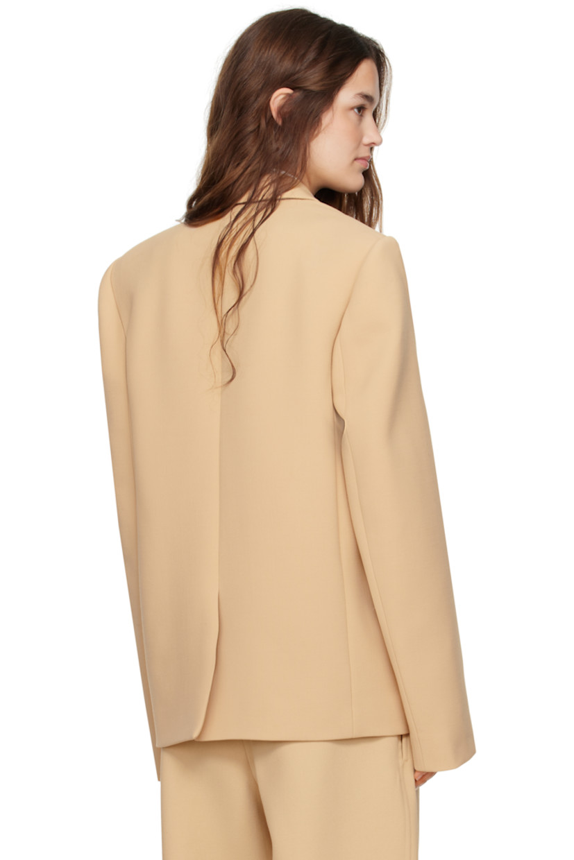 Virgin wool twill blazer.

· Notched lapel
· Double-breasted button closure
· Flap pockets
· Padded shoulders
· Central vent at back hem
· Welt pocket at interior
· Full viscose satin lining

Part of the WARDROBE.NYC x Hailey Bieber collaboration.

Supplier color: Biscuit