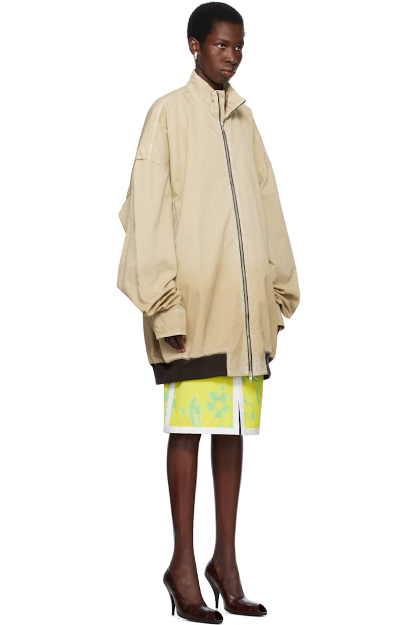 Oversized cotton twill bomber jacket. Fading and subtle distressing throughout. 

· Stand collar
· Two-way zip closure
· Welt pockets
· Rib-knit hem
· Dropped shoulders
· Velcro tab at cuffs
· Unlined

Supplier color: Beige