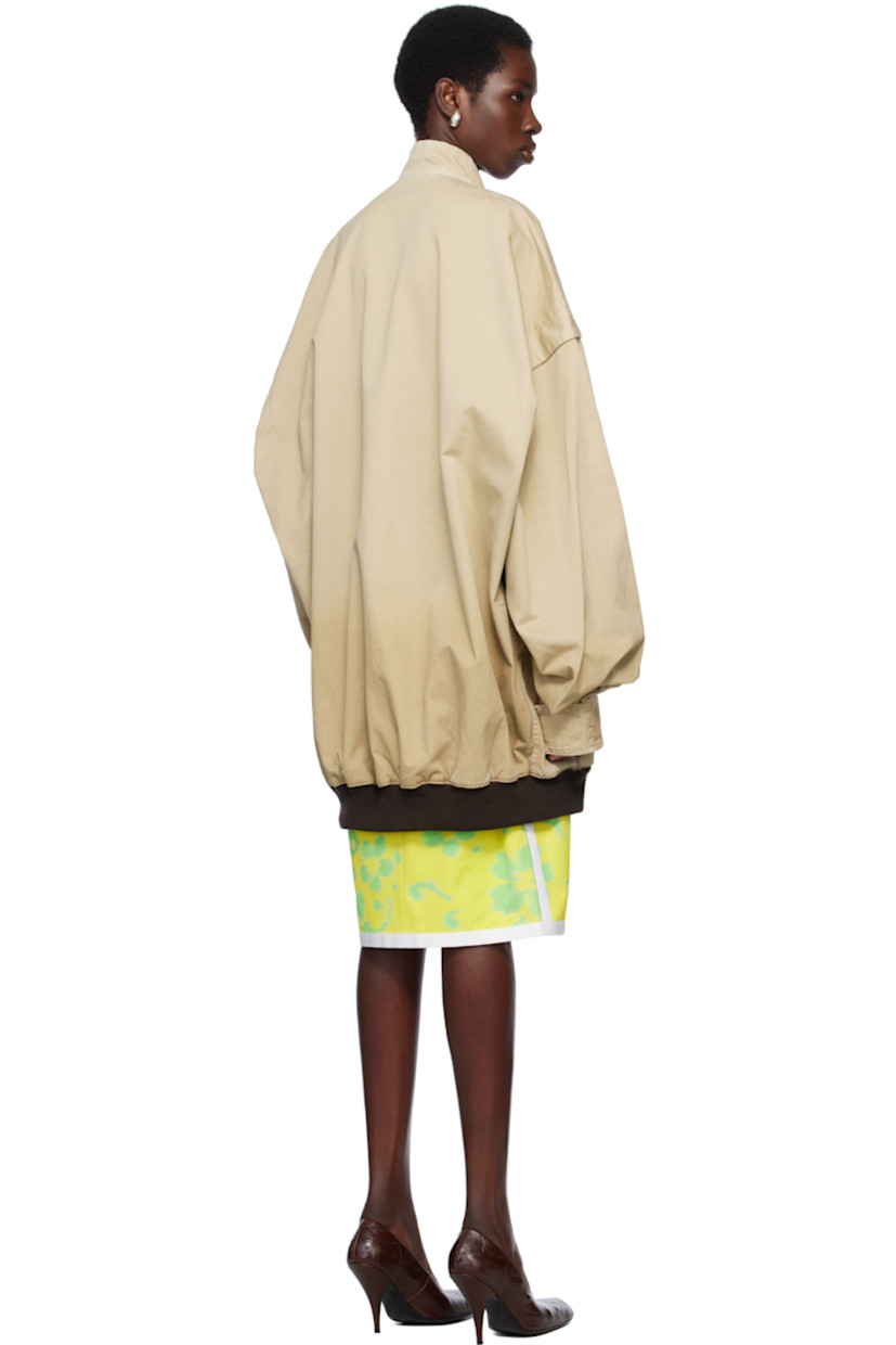 Oversized cotton twill bomber jacket. Fading and subtle distressing throughout. 

· Stand collar
· Two-way zip closure
· Welt pockets
· Rib-knit hem
· Dropped shoulders
· Velcro tab at cuffs
· Unlined

Supplier color: Beige