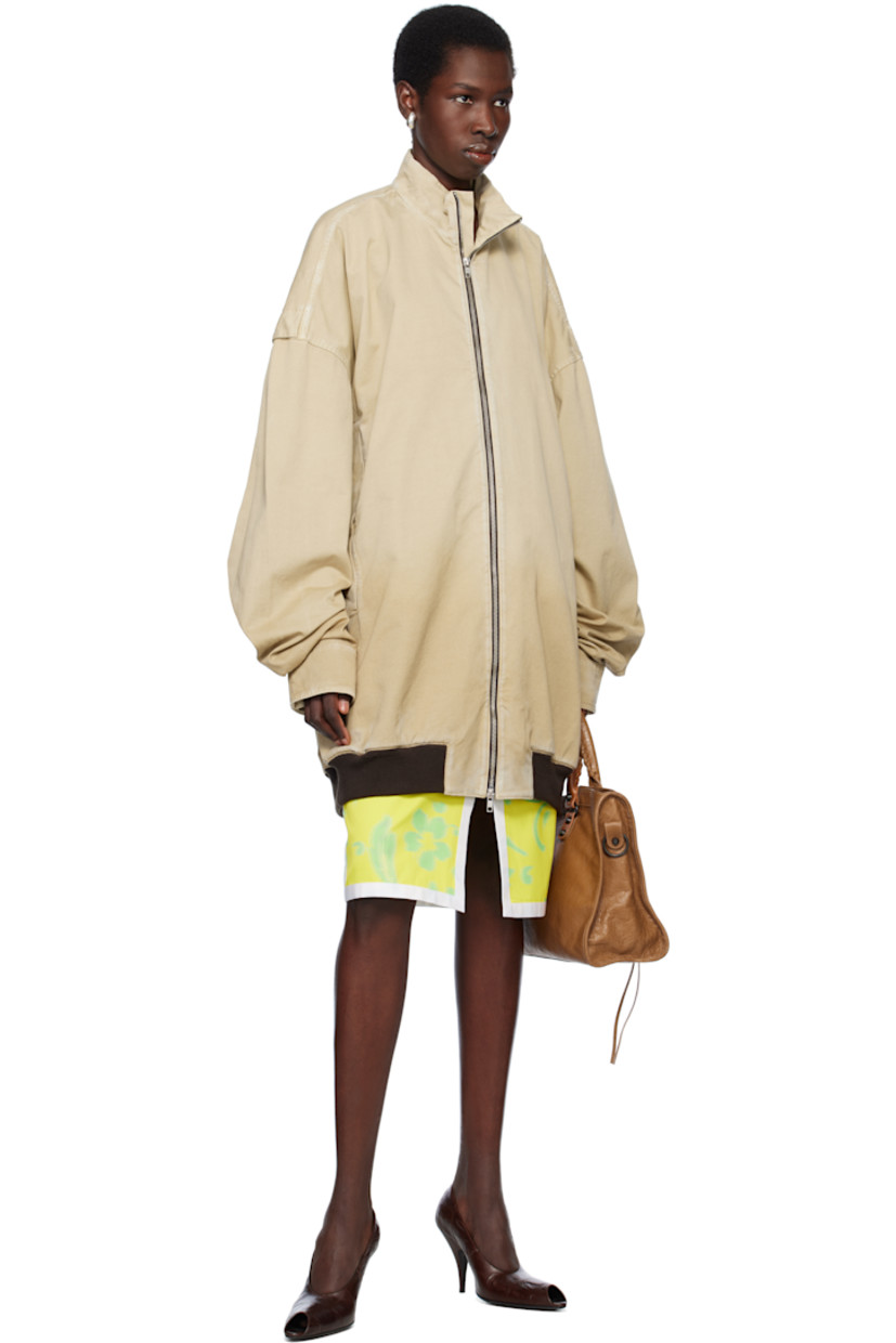 Oversized cotton twill bomber jacket. Fading and subtle distressing throughout. 

· Stand collar
· Two-way zip closure
· Welt pockets
· Rib-knit hem
· Dropped shoulders
· Velcro tab at cuffs
· Unlined

Supplier color: Beige
