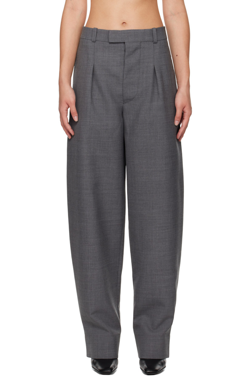 Tapered and wide-leg virgin wool canvas trousers.

· Low-rise
· Belt loops
· Three-pocket styling
· Button-fly
· Pleats at front 

Part of the WARDROBE.NYC x Hailey Bieber collaboration.

Supplier color: Charcoal