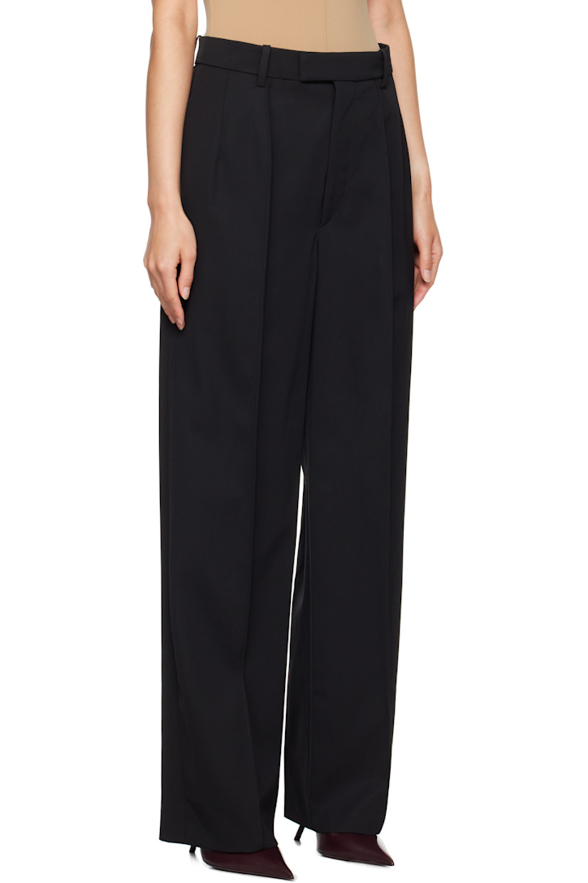 Wide-leg and tapered wool twill trousers. 

· Belt loops 
· Four-pocket styling
· Zip-fly
· Pleats at front 
· Pinched seam at front and back legs
· Darts at back waistband 

Part of the WARDROBE.NYC x Rosie Huntington-Whiteley collaboration.

Supplier color: Black