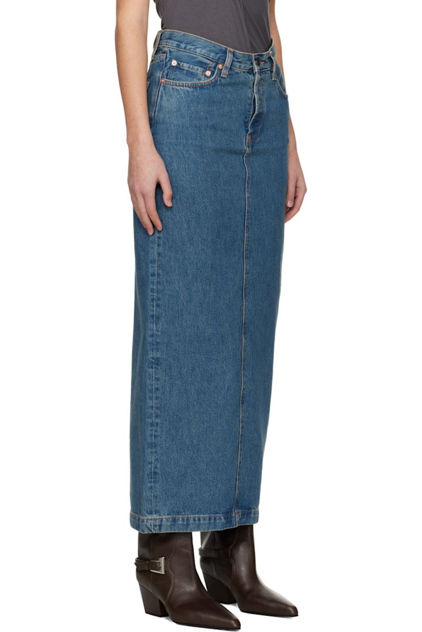 Non-stretch 14 oz denim midi skirt. Fading throughout.

· Belt loops
· Five-pocket styling
· Button fly
· Leather logo patch at back waistband
· Central vent at back hem
· Contrast stitching in tan

Supplier color: Indigo