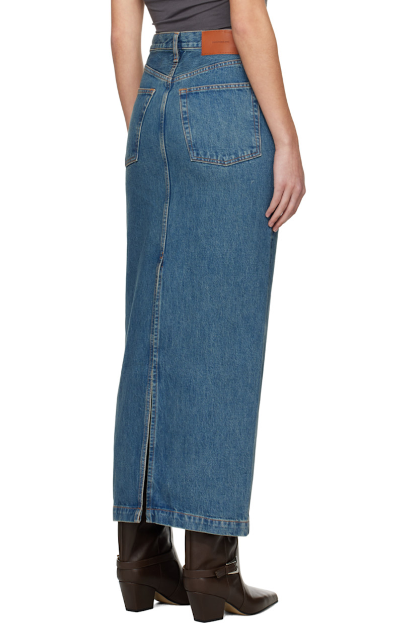 Non-stretch 14 oz denim midi skirt. Fading throughout.

· Belt loops
· Five-pocket styling
· Button fly
· Leather logo patch at back waistband
· Central vent at back hem
· Contrast stitching in tan

Supplier color: Indigo