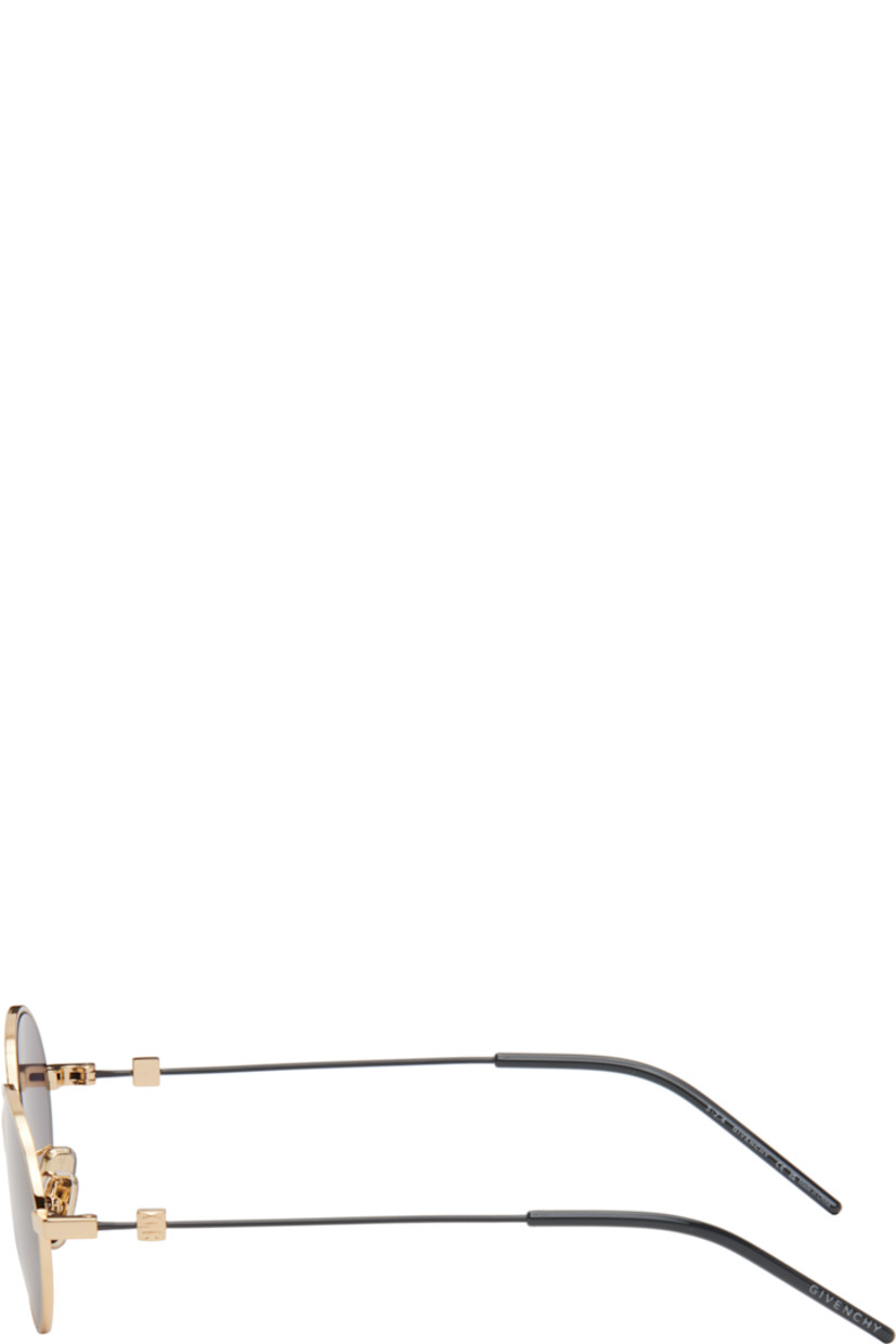 Round metal-frame sunglasses in gold tone.

· Gray lenses
· 100% UVA/UVB protection, Category 3
· Adjustable rubber nose pads
· Logo hardware at temples
· Logo etched at nylon temple tips
· Includes pouch
· Size: 51.20 145

Supplier color: Black/Golden