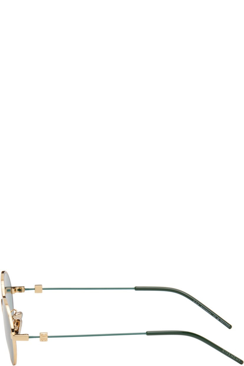 Round metal-frame sunglasses in gold tone.

· Green lenses
· 100% UVA/UVB protection, Category 3
· Adjustable rubber nose pads
· Logo hardware at temples
· Logo etched at nylon temple tips
· Includes pouch
· Size: 51.20 145

Supplier color: Green/Golden
